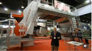 Gerry Vanderbas at Marmomacc, Verona Italy — standing before a Paragon multi-wire saw